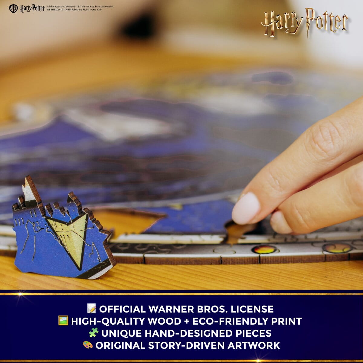 Wooden model of a castle with 'Harry Potter' branding, held by a hand over a puzzle.