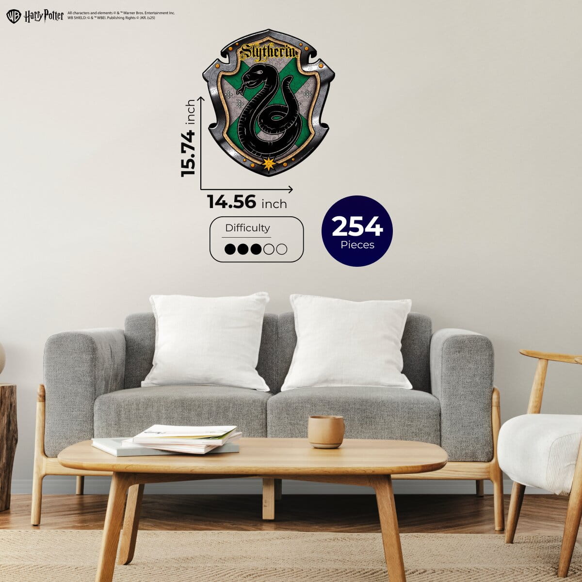 Living room with a gray sofa, wooden coffee table, and 'Slytherin' wall decal from Harry Potter.