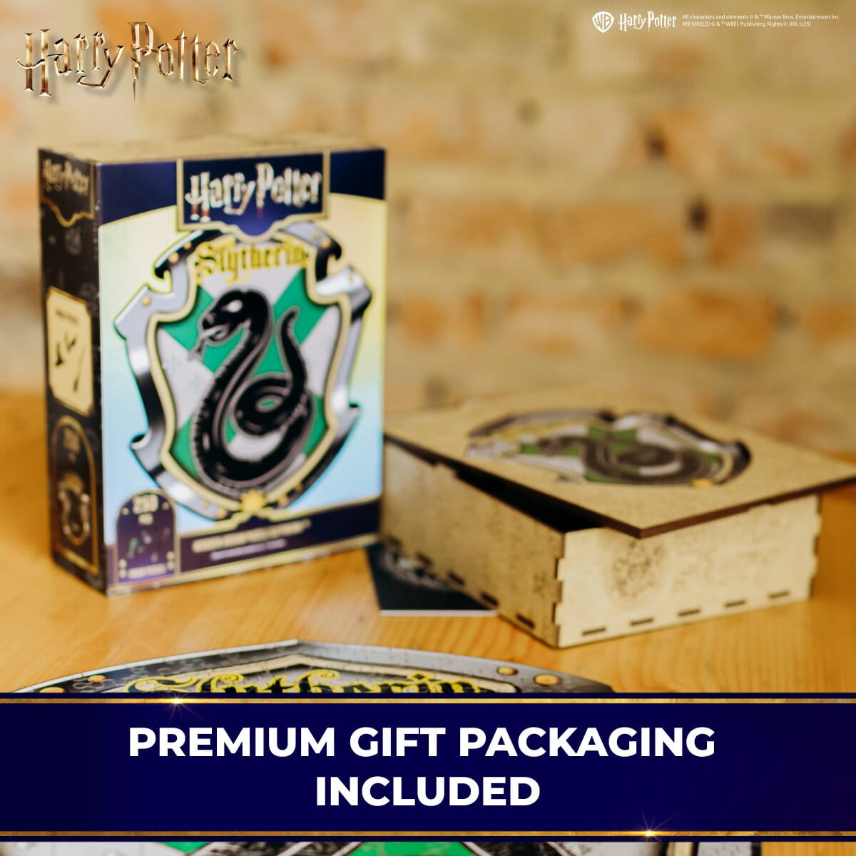 Harry Potter Slytherin-themed product packaging with a snake emblem on a wooden surface.