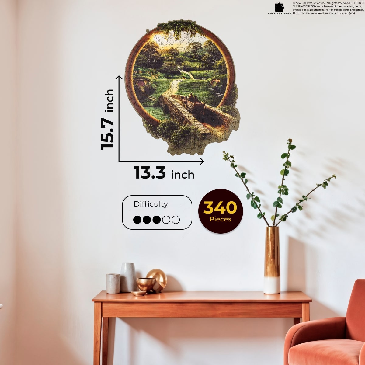 Wall art with scenic design on a wall above a wooden table and chair.