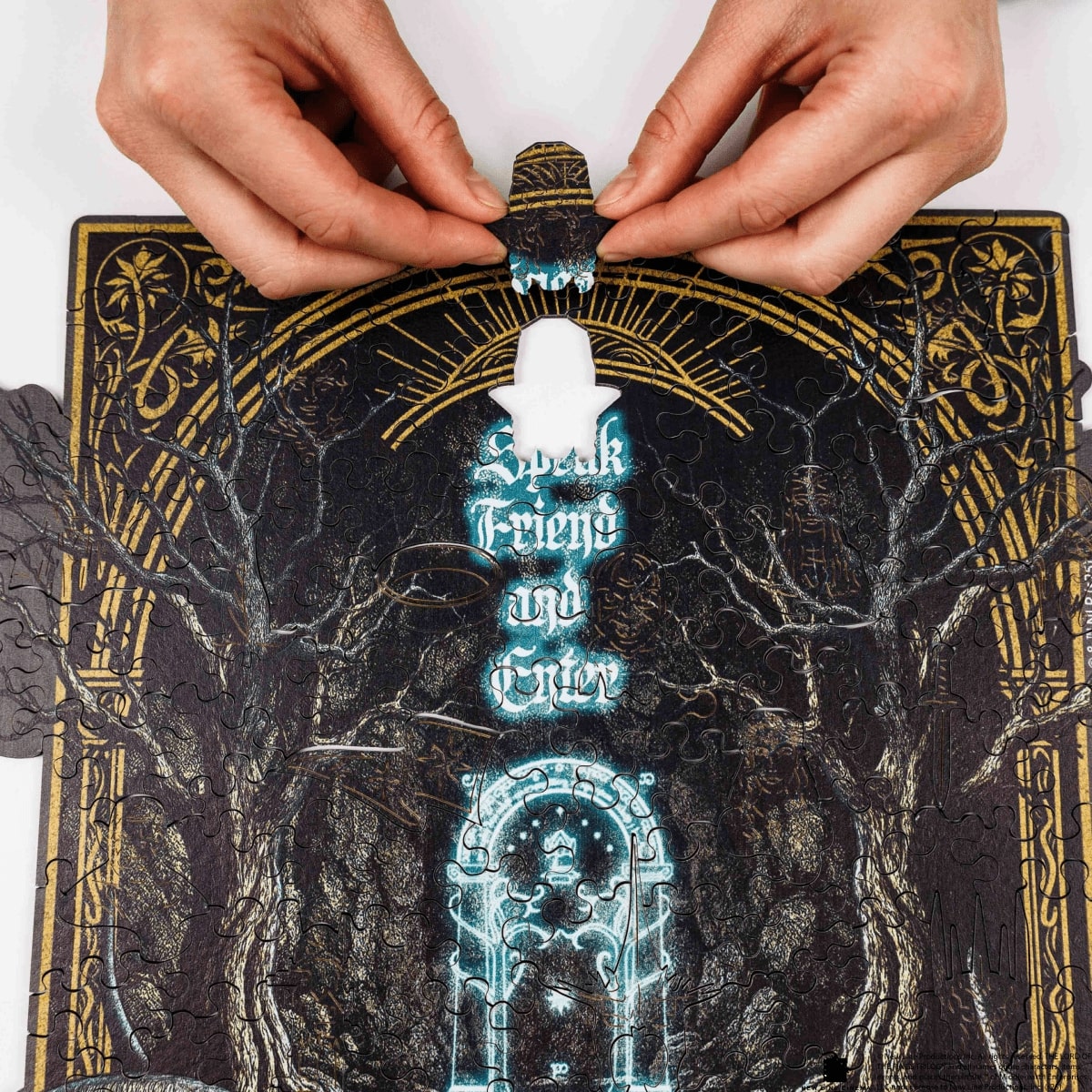 Hands interacting with a tarot card featuring mystical designs and text.