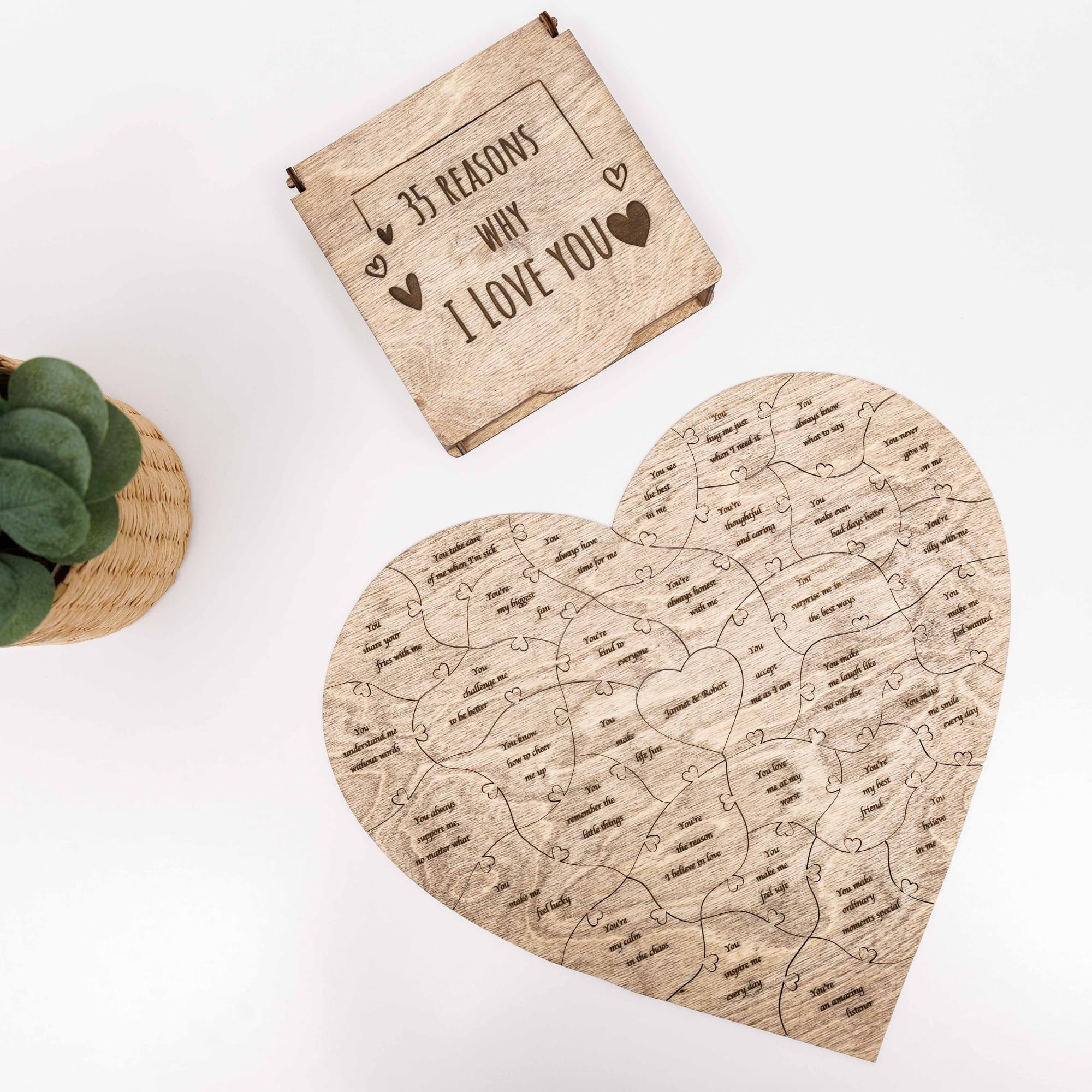 Heart-shaped wooden puzzle with '35 Reasons Why I Love You' text on a white background