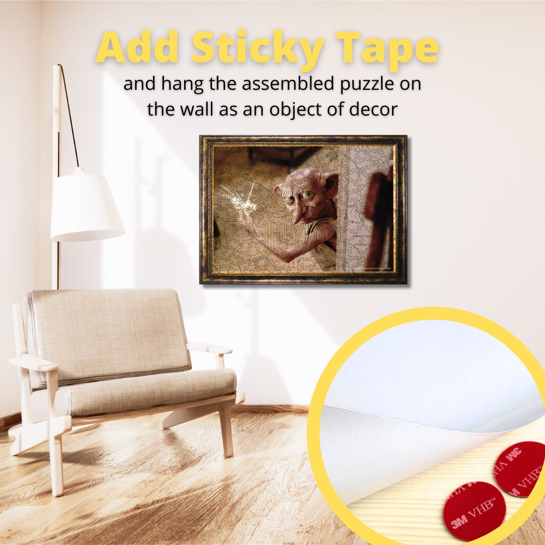 A wooden jigsaw puzzle depicting the character Dobby from Harry Potter, with the puzzle box displayed in front.