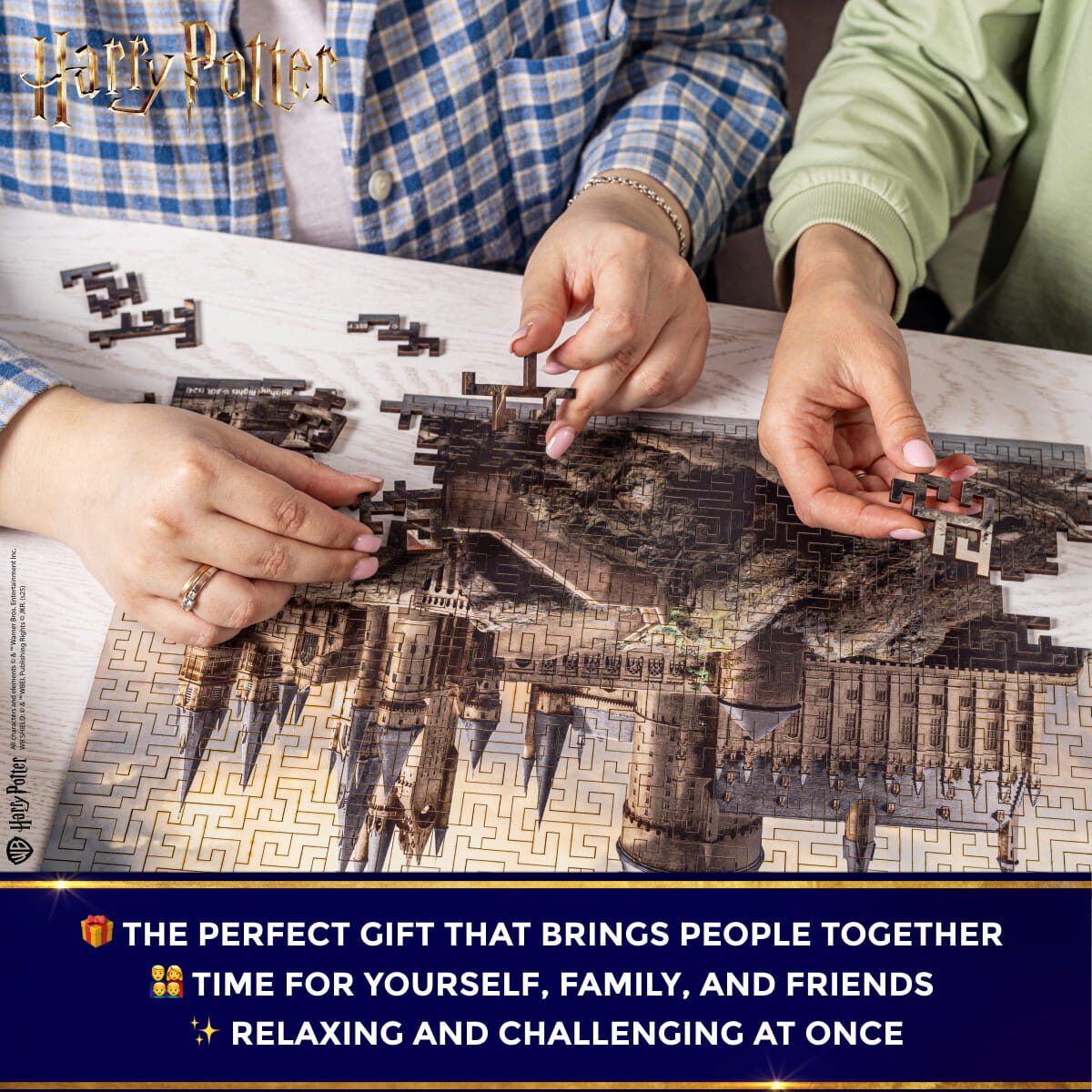 Two people working on a puzzle together with a Harry Potter theme.
