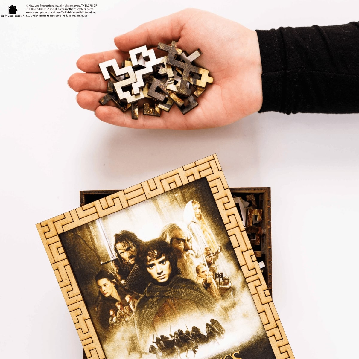 Mosaic art of a person wearing a fur hat and green coat with a pipe.