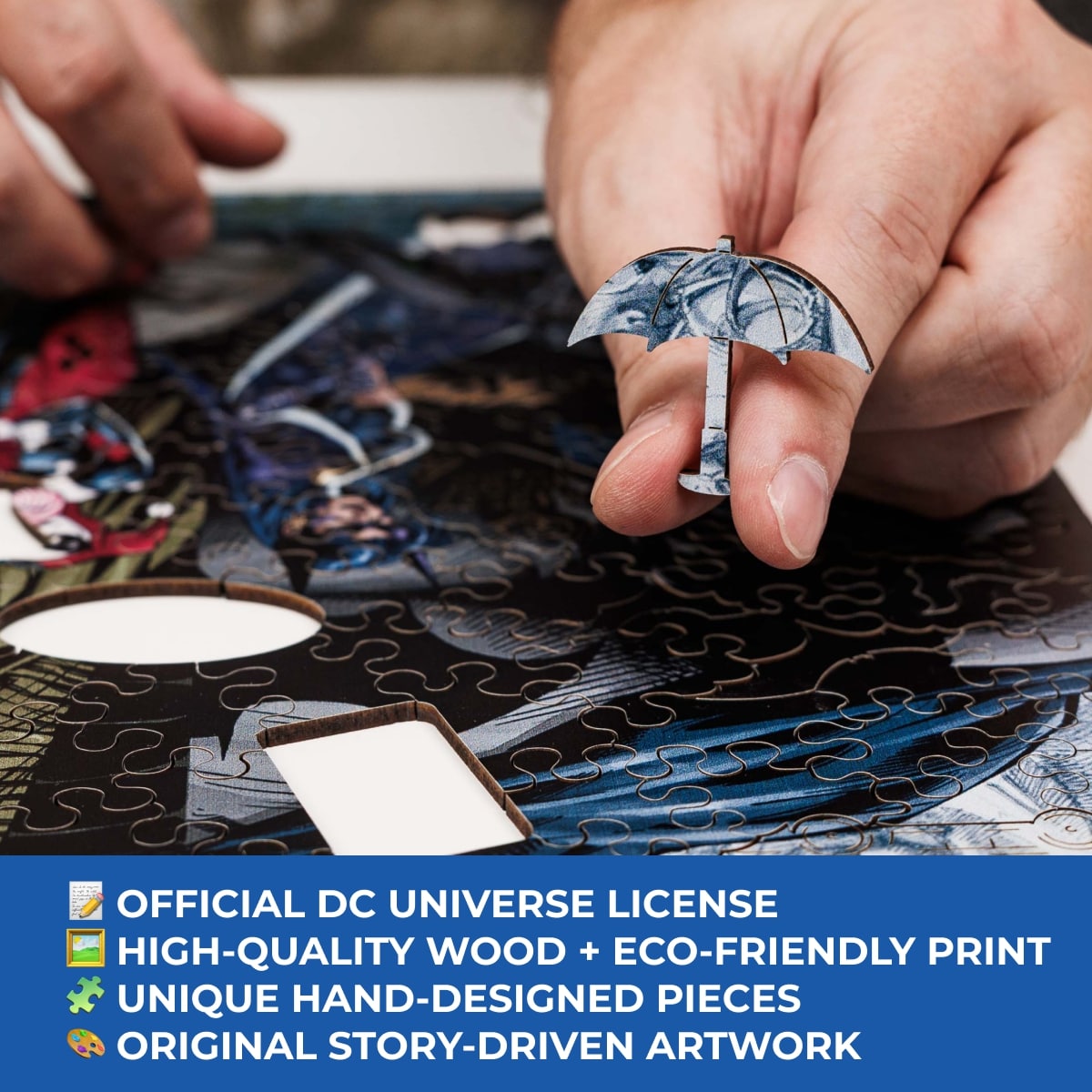 Person assembling a puzzle with DC Universe-themed pieces, featuring an umbrella design.