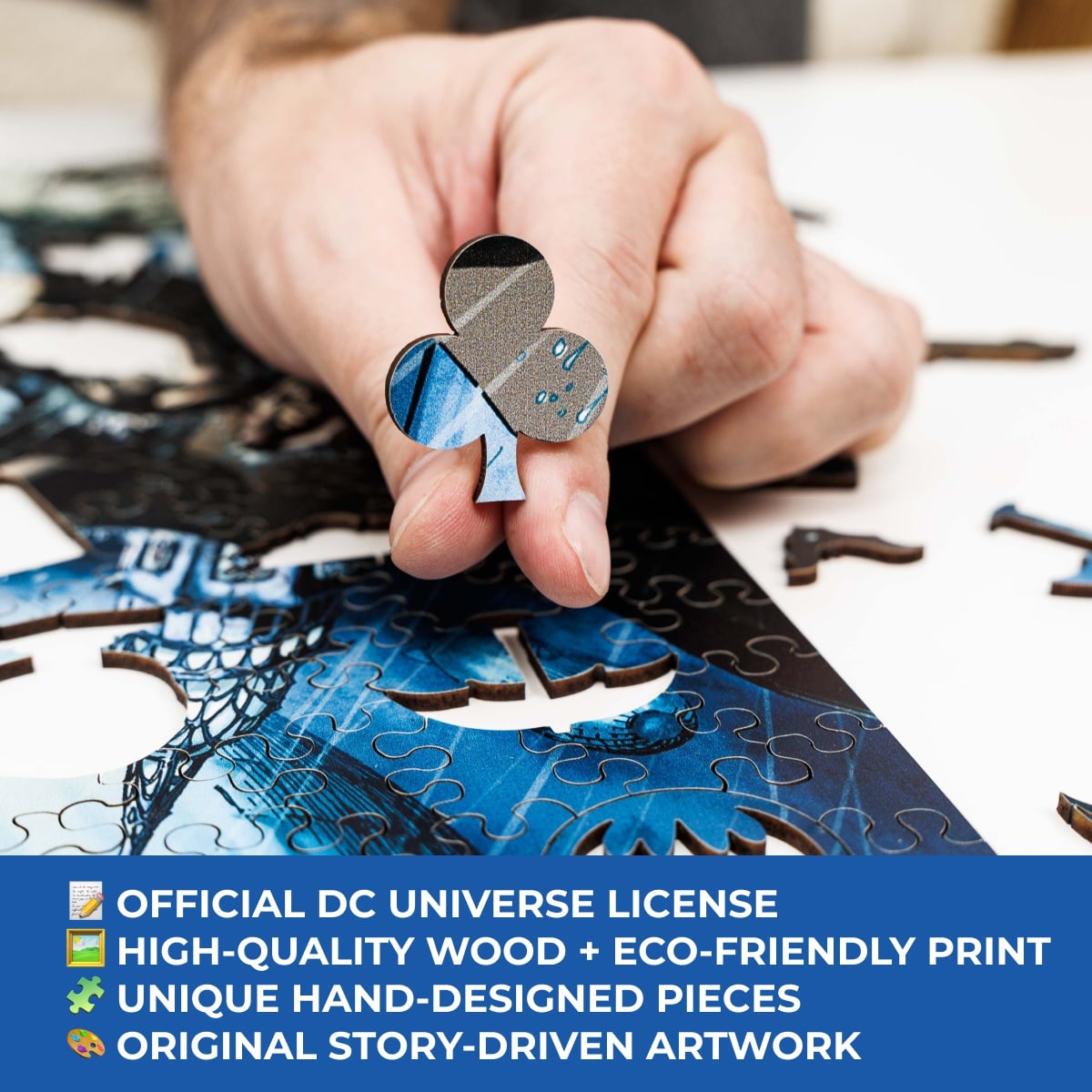 Hand assembling a puzzle piece with text about DC Universe license and eco-friendly print.
