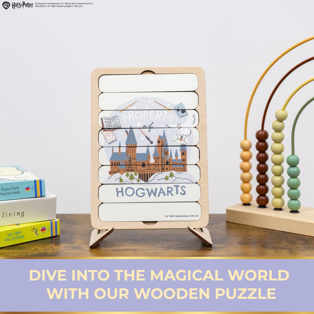 Wooden puzzle with Hogwarts design on a wooden surface, books, and an abacus in the background.